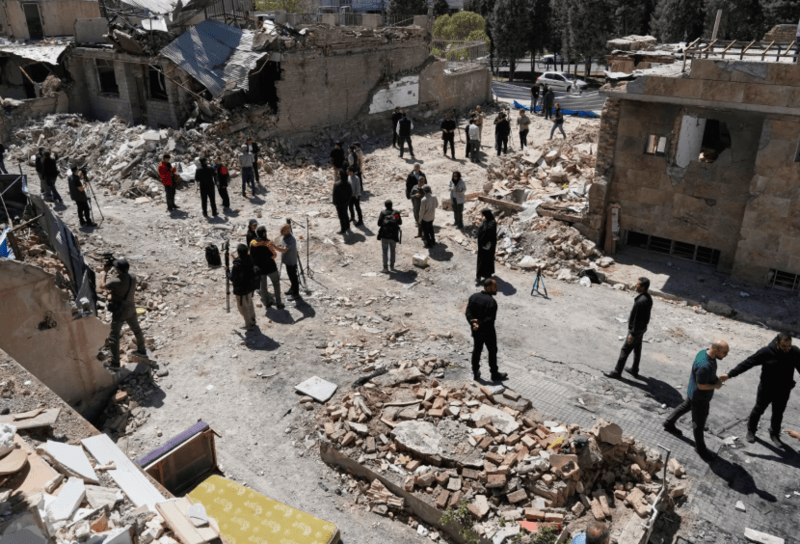 Journalists from foreign media based in Tehran document damage from U.S.-Israeli strikes in a residential area of the town of Fardis, Iran. (AP Photo/Vahid Salemi)